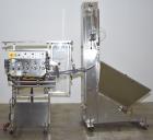 Used E-Pak Automatic Inline Quill Capper with Integrated Cap Elevator/Sorter.